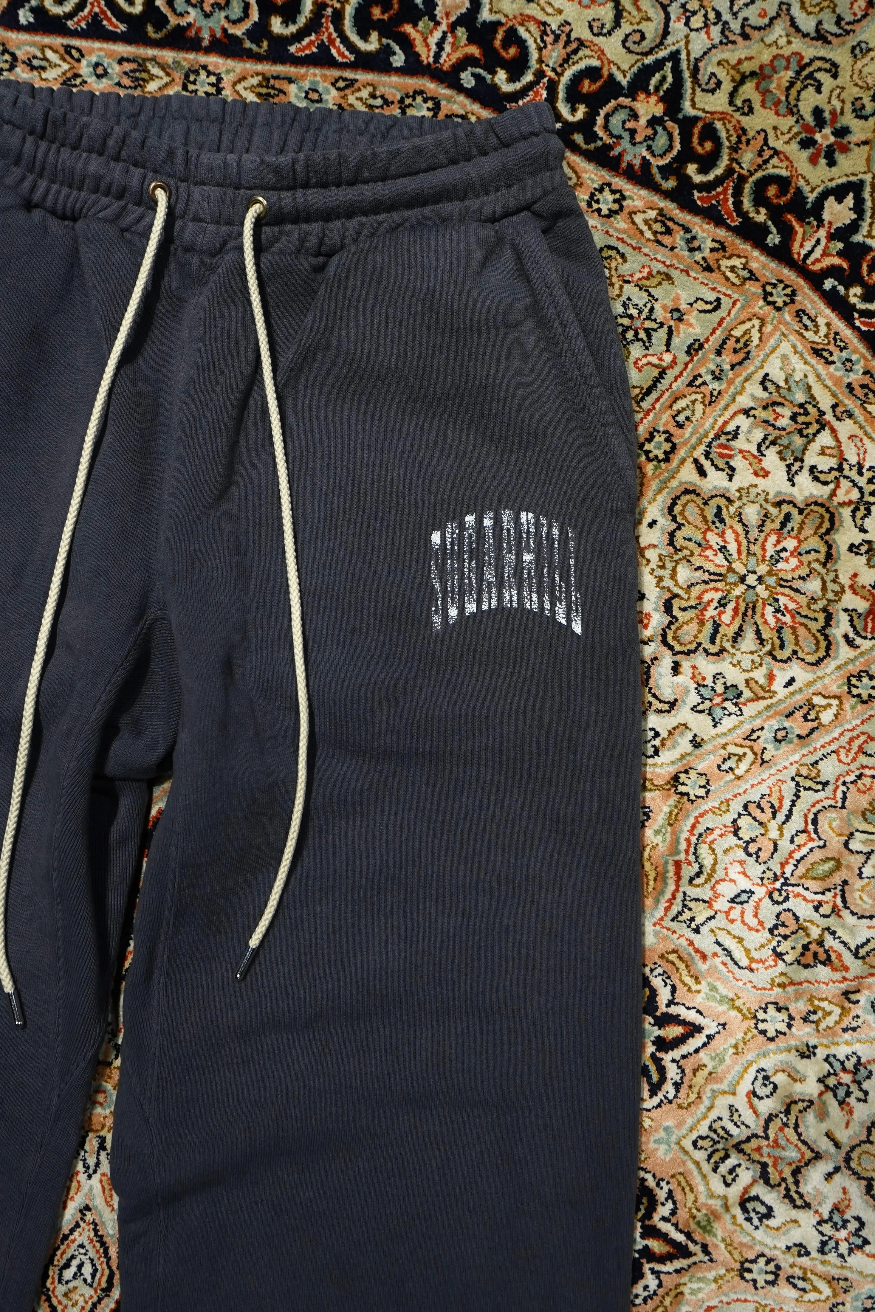 SUGARHILL COLLEGE PRINTED SWEAT TROUSERS (AGED BLACK)